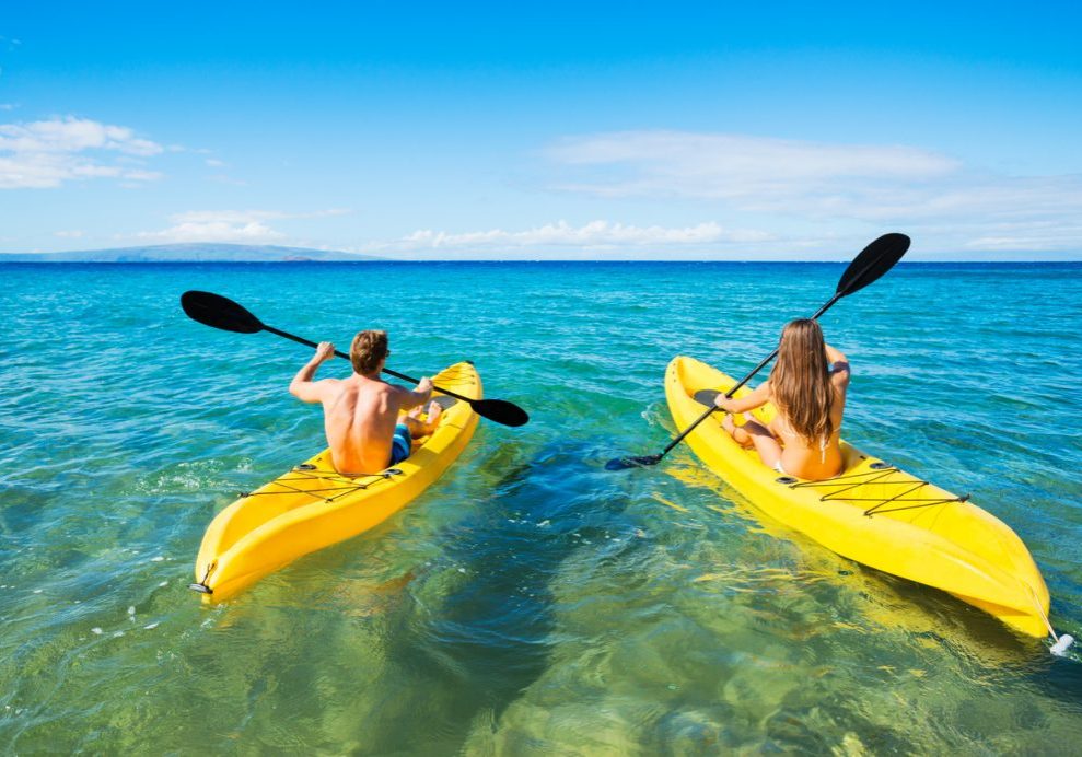 Couple Kayaking in the Ocean on Vacation